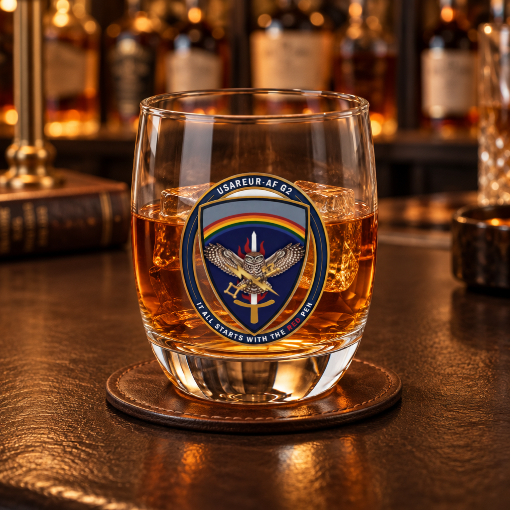 USAREUR-AF G2 Whiskey Glass with the G2 mark, filled, on a bar